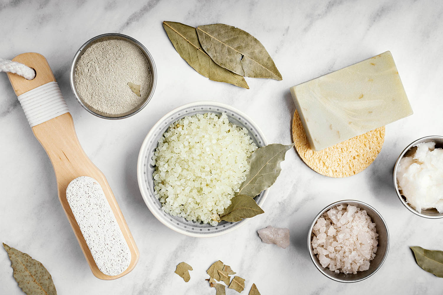 Honey, oats, coffee, milk, and cocoa beside handmade soap bars