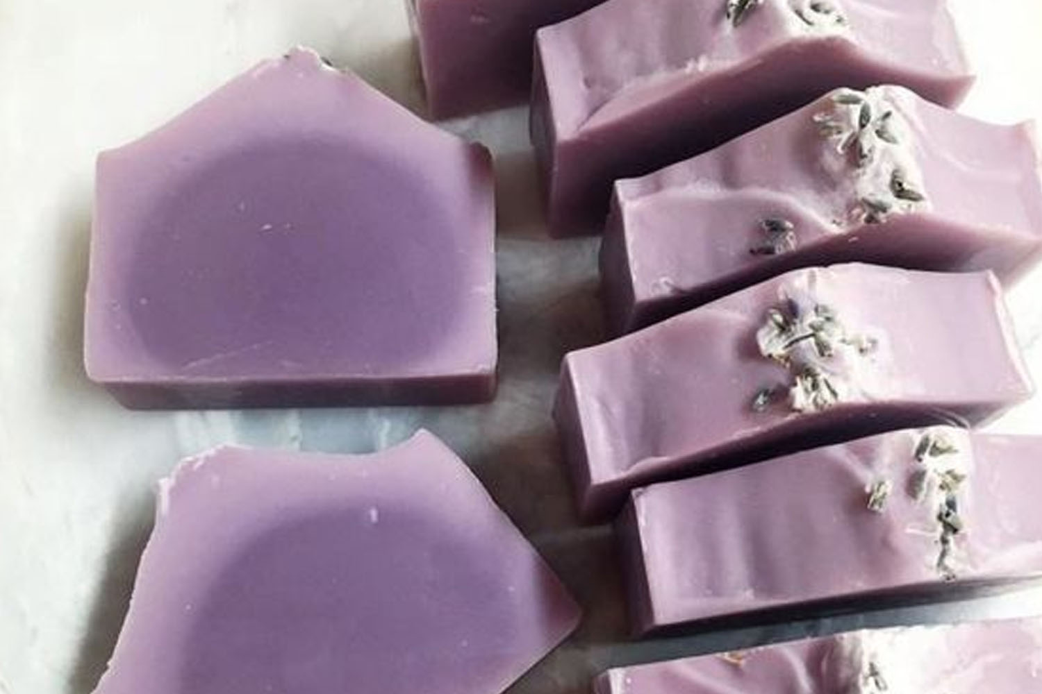 Cut cold process soap bars showing a darker partial gel circle in the center